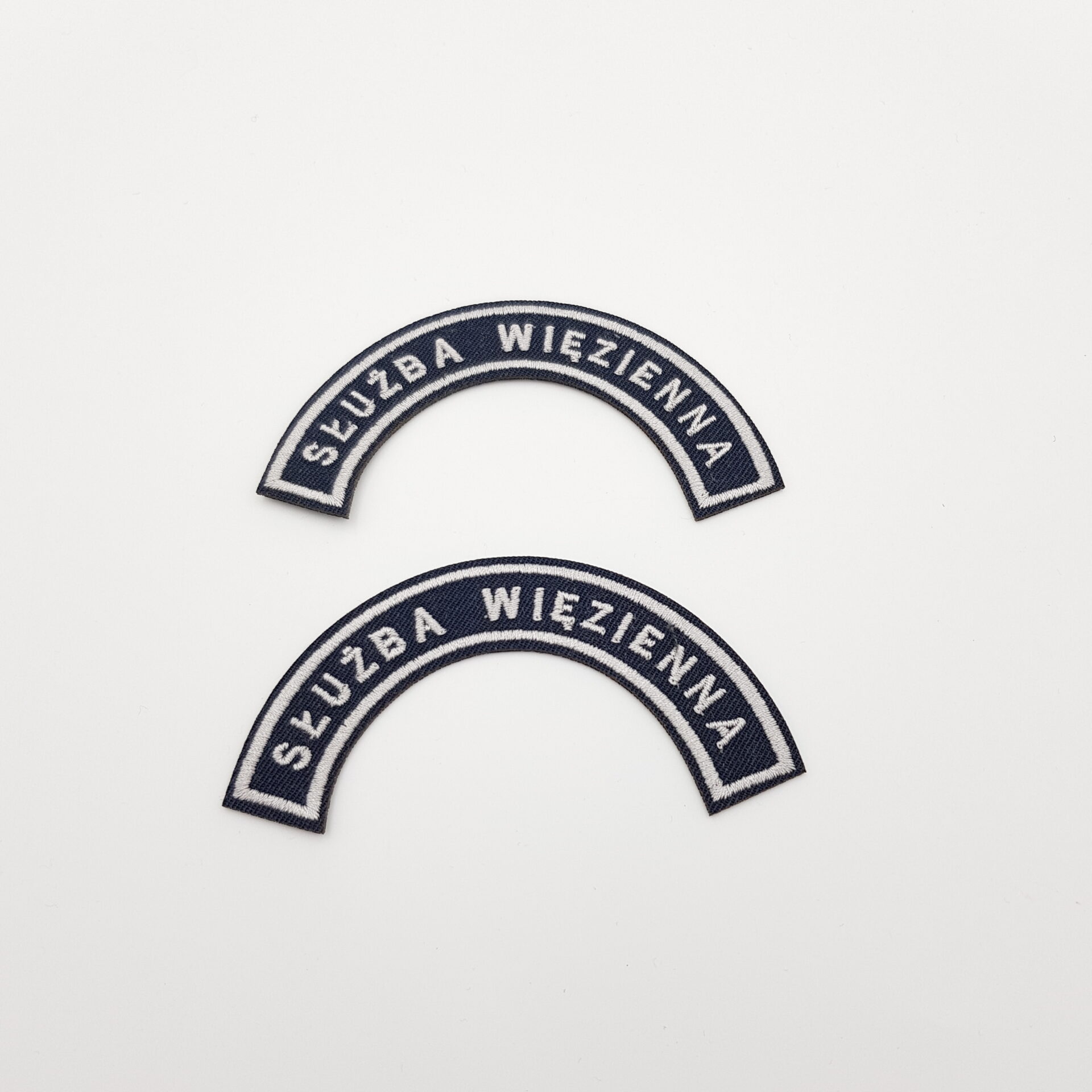 Oznaka służby w kształcie półkolistym SW